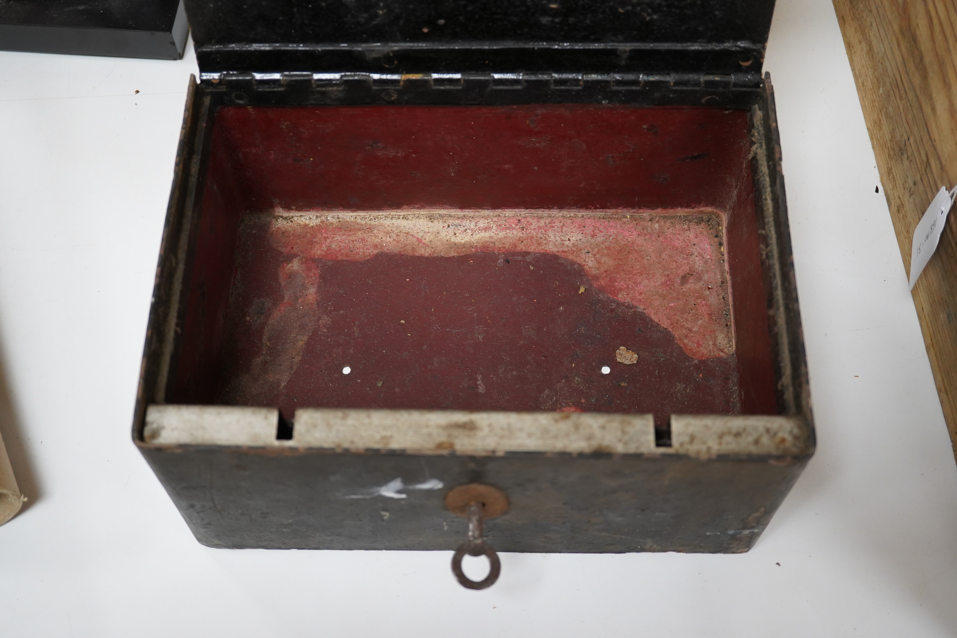 A 19th century strongbox with key, 26cm wide. Condition - worn but working